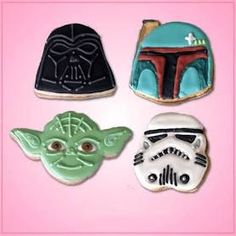 star wars cookies are decorated to look like they have helmets on them