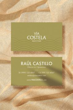 two business cards with gold foil on them