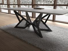 a white table sitting on top of a rug in front of a large glass window