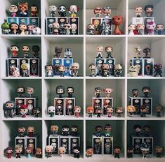 a shelf filled with lots of different types of action figures and pictures on it's sides