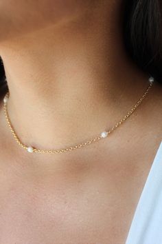 With a dainty golden chain and freshwater pearls, our Serenity Golden Pearl Necklace that takes center stage. This delicate necklace is the perfect statement piece to dress up any outfit. You can also layer this piece to make your look bolder. MATERIALS & SIZE Material: 14k Gold Filled Chain and Freshwater Pearls Measurements: 14 in. Closure: Lobster Clasp Extender: 2 in. View Size Guide JEWELRY CARE Tarnish resistant, hypoallergenic, safe for sensitive skin Handmade with ♡ in New York - To main Necklace With Pearls, Golden Pearl, Golden Chain, Solid Gold Necklace, Freshwater Pearl Necklace, Freshwater Pearl Necklaces, Center Stage, Delicate Necklace, Jewelry Care