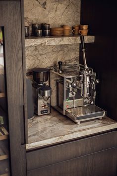 an espresso machine sitting on top of a counter