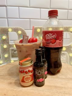 two bottles of iced coffee, one with strawberries and the other with ice cream