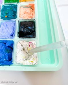 an artist's palette filled with different colored paints