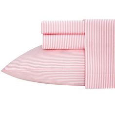 the pink and white striped sheets are folded on top of each other, with two pillows