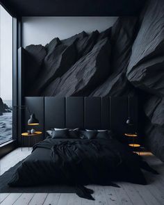 a bed sitting in front of a large window next to a mountain wallpaper covered in black