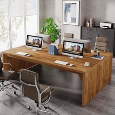 an office desk with two computers on top of it and chairs in front of the desk