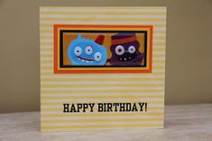 a birthday card with two cartoon characters on the front and one in the back that says happy birthday