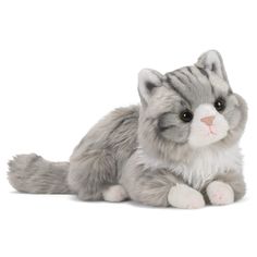 a gray and white stuffed cat laying down