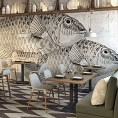 a fish mural on the wall in a restaurant