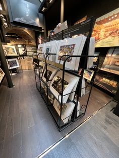 a store filled with lots of books on display next to other items in the room