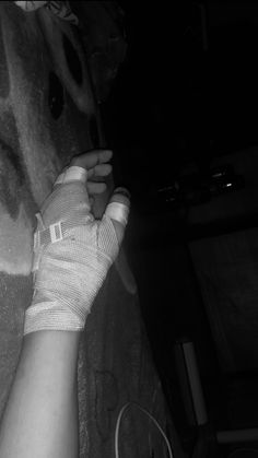 a person with bandages on their arm and hand