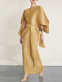 Imagine entering a gallery of modern elegance, where every piece tells a story of craftsmanship and grace. Our latest creation, the 2-Piece Pleated Dress and Shawl Set, is a tribute to this narrative. Crafted from exquisite Japanese pleated fabric, this ensemble merges tradition with contemporary flair. Key Features: Authentic Japanese pleated fabric Sleeveless square neck maxi dress Matching oversized shawl Versatile for daily wear and special occasions Limited edition design Why You'll Love it: Effortless elegance and comfort Perfect for any occasion Size Chart Measurements are in centimeters. Size Shawl Dress One Size Length: 63Bust: 68-114 Length: 139 Elegant High Fashion, Dress And Shawl, Shawl Dress, Pleated Fabric, Guest Dress, Effortless Elegance, Evening Attire, Dress Code, Matching Dresses