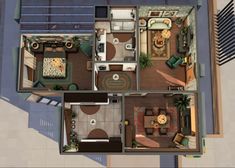 an overhead view of a house with the living room and dining area in one corner