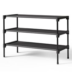 three tiered shelving unit with black shelves