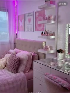 a bedroom with pink and white decor on the walls