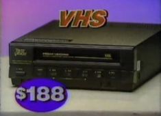 an old vhs player with the words vhs on it's side and a purple background