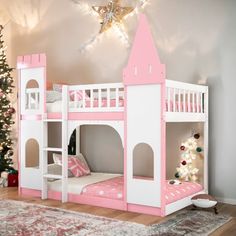 a pink and white bunk bed in a child's room next to a christmas tree