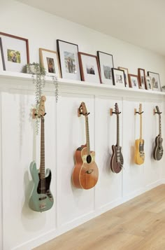 a wall with guitars hanging on it