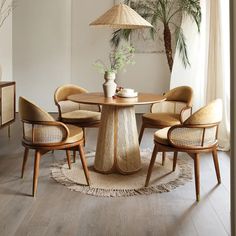 a round table with four chairs and a plant in the center is surrounded by palm trees