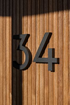 the number 544 is placed next to a wooden wall