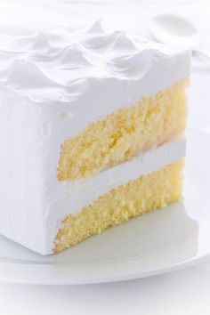 a piece of cake on a plate with white frosting and icing in the middle