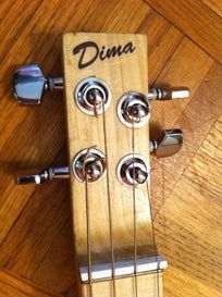 an electric guitar sitting on top of a wooden floor