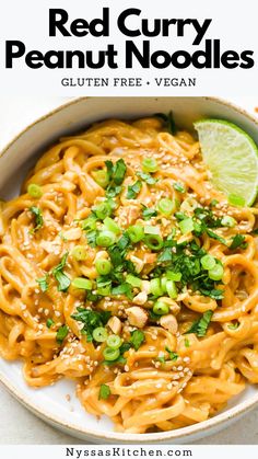 a white bowl filled with red curry peanut noodles