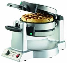 an electric waffle maker is shown on a white background