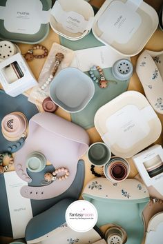 many plates and bowls are arranged together on the floor, including one that has been made from porcelain