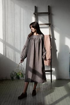 "Victorian dress is made from 100% soft and washed linen.  Details: - Colour: Brown stripe - Composition: 100% Oeko-Tex certified linen - Grey ribbon in the back - Ruffled long sleeves - Pockets - Belt included - Medium weight linen - Linen care: machine wash gentle; tumble dry low, ironing optional - The price is for one dress, other pictured items are not included The model is 170 cm/5'7\" and wears a size XS." Victorian Fashion Dresses, Maxi Dress Long Sleeve, Transparent Dress, Grey Ribbon, Maxi Dress Long, Dress Linen, Ruffle Long Sleeve, Linen Maxi Dress, Dress Long Sleeve