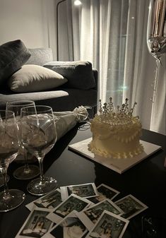 a table topped with wine glasses and a cake