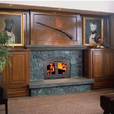 a living room filled with furniture and a fire place next to a wall mounted painting