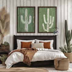 a bedroom with two cactus paintings on the wall and a bed in the foreground