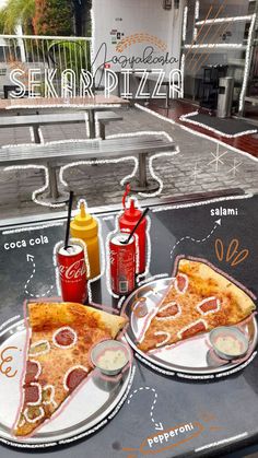 two slices of pizza on plates with ketchup, mustard and ketchup