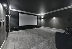 an empty room with a large screen in it