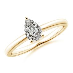 a yellow gold engagement ring with a pear shaped diamond