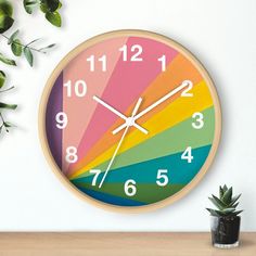 a clock that is on the wall next to a potted plant and some plants