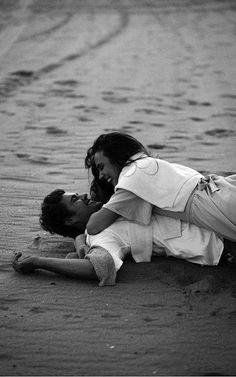 a man and woman laying on the ground with a quote above them that says,