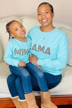 Long sleeve design makes it a perfect pick all Fall / Winter Mom & child tops both feature trendy cheetah print Mom top reads "Mama" & child top reads "Mini" Ultra soft material for comfort & ease These "Mama & Mini" Long Sleeve Tops in Mint features long sleeves and a fun cheetah saying embossed on the front. In a versatile mint, this top is made from soft and breathable fabric that will keep her comfy during all adventures. She can pair it with a variety of SIP bottoms & our booties for the pe Top Reads, Children Top, Long Sleeve Design, Mom Kid, Sleeve Designs, Cheetah Print, Soft Material, Advent, Breathable Fabric