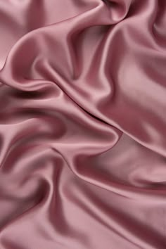 a close up view of a pink satin fabric