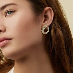 A new iteration of our signature Crescent Hoops, the Poppy Hoops are designed with the four unique diamond motifs that make up the Poppy collection. The lightweight silhouette allows each hoop to wrap slightly around the lobe of the ear giving the piece a dimensional and innovative feel. Handcrafted in 18-karat gold and featuring 5.70tcw of marquise, pear, and round shaped diamond clusters, the Poppy earrings are the perfect occasional piece that add the right amount of glam and sparkle to any l Poppy Earrings, Bespoke Engagement Ring, Heart Shaped Diamond, The Ear, Unique Diamonds, Pendant Design, Diamond Cluster, Huggies Earrings, Brilliant Cut Diamond