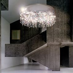 a chandelier hanging from the ceiling in a room