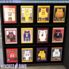 a display case filled with basketball memorabilia and framed sports jerseys in multiple frames on the wall