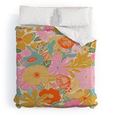 an image of a bed set with flowers on the comforter and pillowcases