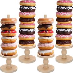 several donuts stacked on top of each other in different shapes and sizes, with icing