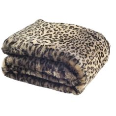 the leopard print blanket is folded on top of it's own fur pillow cover