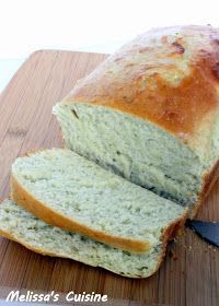 sliced loaf of bread sitting on top of a cutting board