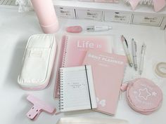 the contents of a personal planner laid out on a desk