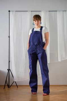 "Your dream vintage denim chore overalls in indigo blue. 100% cotton German workwear from the 1970s in pristine condition, the highest quality I have seen so far! Starting from the high quality, sturdy, durable fabric through the perfect stitches to the stunning label on the inside, it is a perfect piece. It features straight leg and high waist. It is elevated with a number of pockets: large side patch pockets, one pocket at thigh height, one back pocket and a patch and a zip pocket on the bib. Indigo Cotton Denim Jumpsuit Overall, Indigo Cotton Denim Jumpsuit, Utility Cotton Overalls With Bib Front, Cotton Utility Overalls With Bib Front, Workwear Bib Front Jeans With Pockets, Workwear Jeans With Bib Front And Pockets, Workwear Bib Front Jeans, Cotton Denim Jumpsuit With Bib Front And Pockets, Cotton Denim Jumpsuit With Bib Front